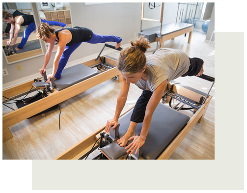 Two women taking Pilates class